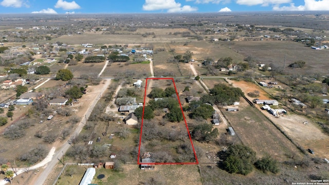 birds eye view of property featuring a rural view