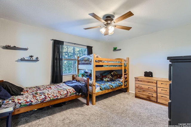 carpeted bedroom featuring a ceiling fan