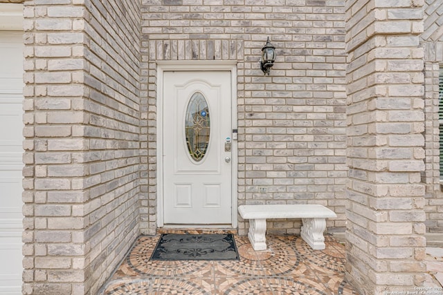 property entrance featuring stone siding