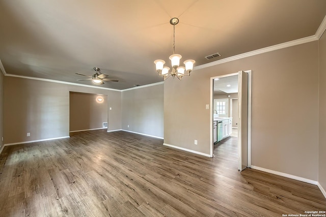 unfurnished room featuring visible vents, crown molding, baseboards, ceiling fan with notable chandelier, and wood finished floors