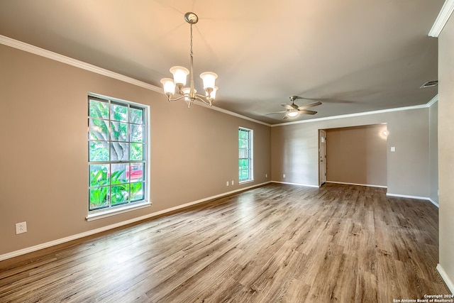 empty room with wood finished floors, visible vents, baseboards, ornamental molding, and ceiling fan with notable chandelier