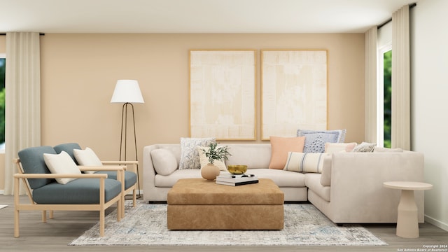 living room with baseboards and wood finished floors