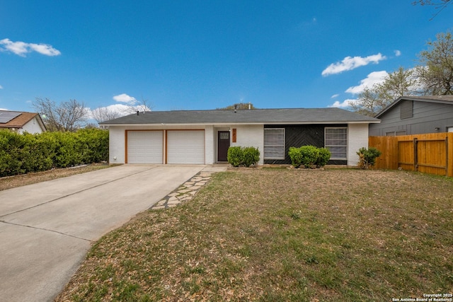 single story home featuring fence, concrete driveway, a front yard, an attached garage, and brick siding