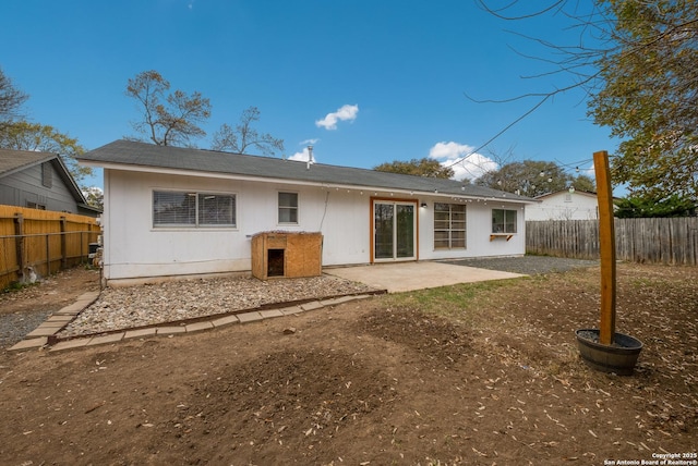 back of house with a patio area and a fenced backyard