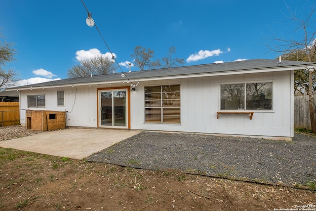 back of house with a patio area and fence