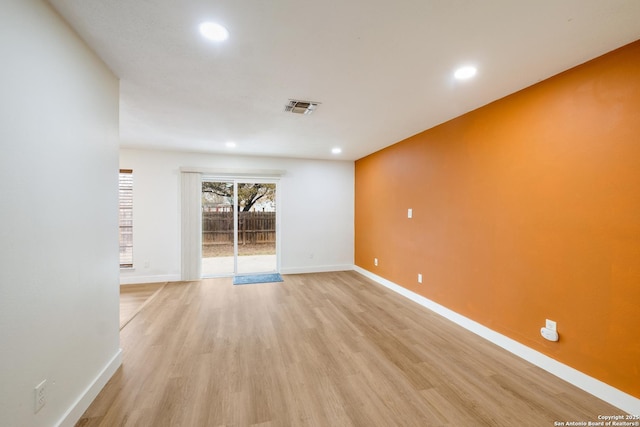 spare room featuring recessed lighting, visible vents, baseboards, and light wood finished floors