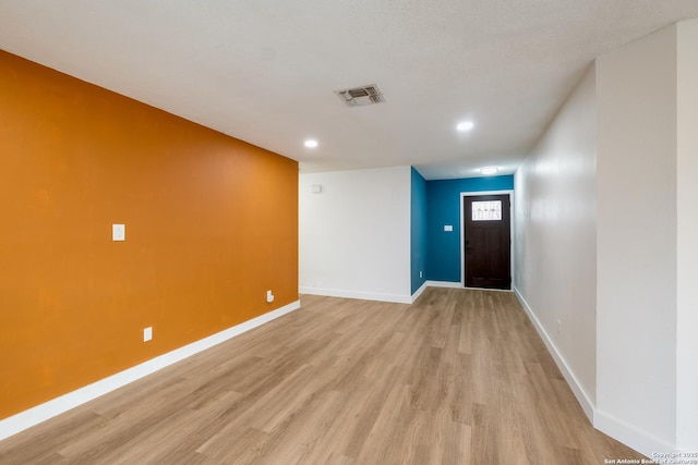 interior space with visible vents, recessed lighting, baseboards, and light wood-style floors