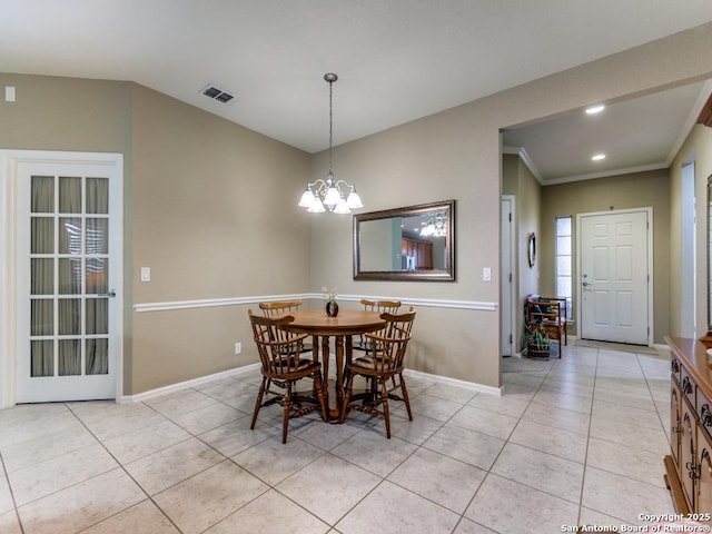 dining room with a notable chandelier, light tile patterned floors, baseboards, and visible vents