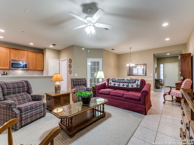 living room featuring light tile patterned floors, recessed lighting, and a ceiling fan