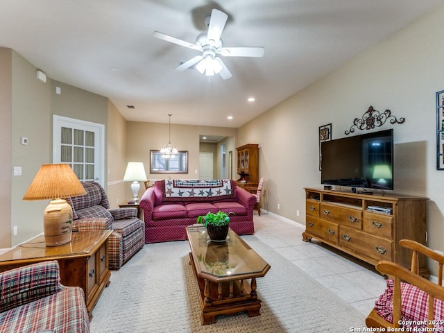 living area with visible vents, ceiling fan with notable chandelier, recessed lighting, light tile patterned flooring, and baseboards