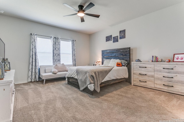 bedroom featuring light carpet and ceiling fan