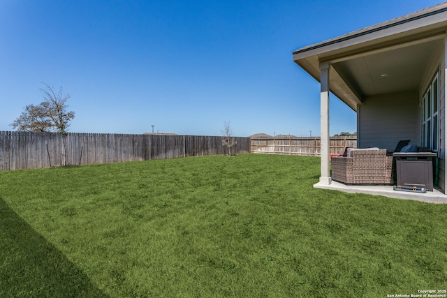 view of yard with a fenced backyard