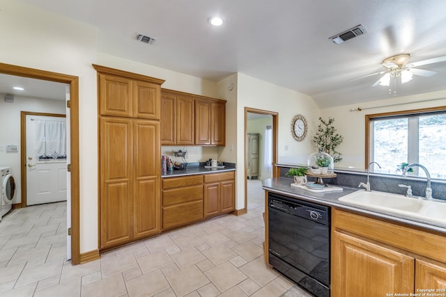 kitchen featuring visible vents, ceiling fan, dishwasher, washer / dryer, and a sink