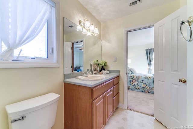 bathroom featuring visible vents, vanity, ensuite bathroom, and toilet