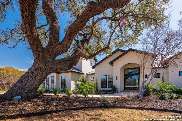 view of front of house featuring stucco siding