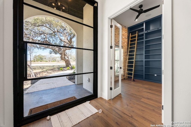 entrance foyer featuring wood finished floors and a ceiling fan