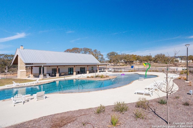 pool with fence and a patio area