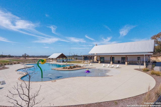 pool featuring a gazebo, a patio, and fence