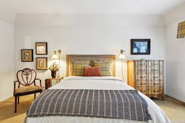 bedroom featuring carpet and baseboards