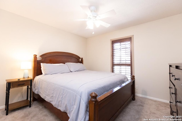 carpeted bedroom with baseboards and ceiling fan