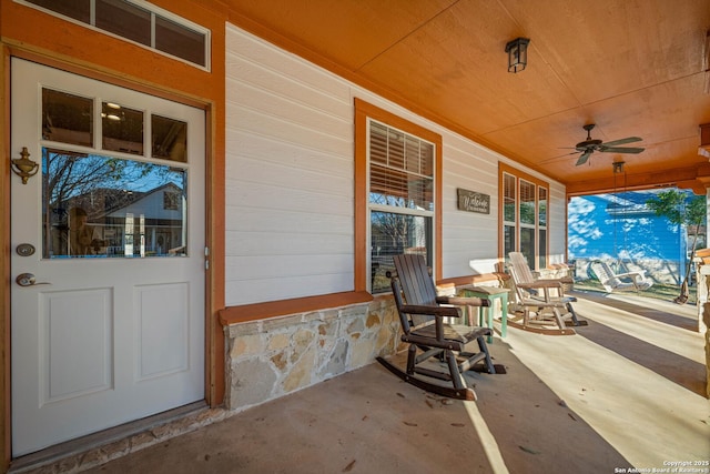 view of patio / terrace with a porch and a ceiling fan