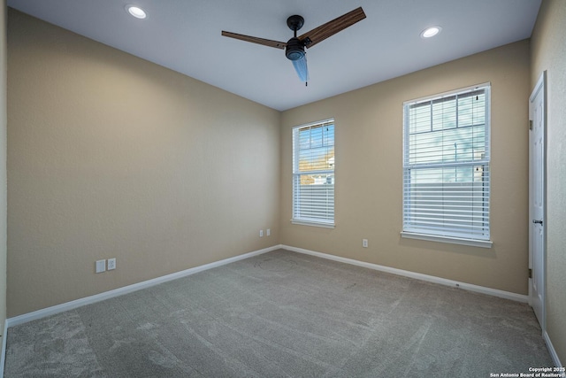 empty room featuring carpet flooring, recessed lighting, baseboards, and ceiling fan