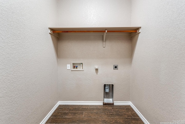 washroom featuring electric dryer hookup, dark wood-type flooring, hookup for a gas dryer, hookup for a washing machine, and laundry area