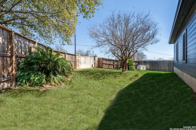 view of yard with a fenced backyard