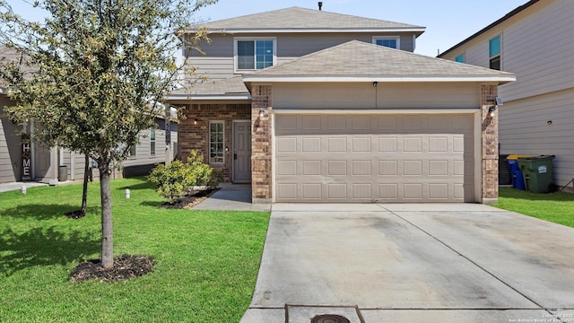 traditional home with driveway, a front yard, a shingled roof, a garage, and brick siding