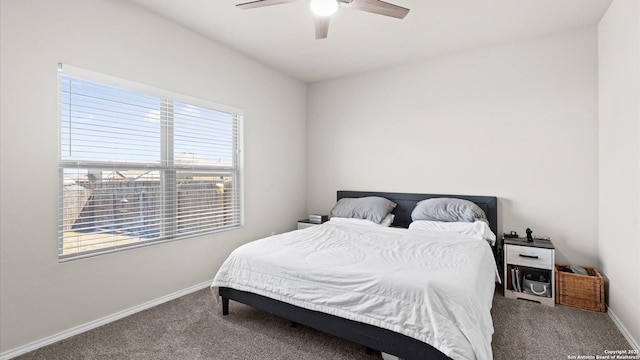 carpeted bedroom with baseboards and a ceiling fan