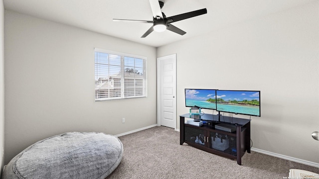 sitting room with carpet flooring, ceiling fan, and baseboards