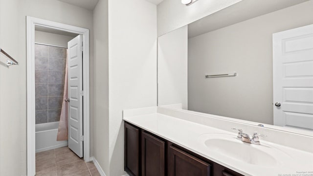 full bathroom featuring tile patterned flooring, vanity, and bathing tub / shower combination