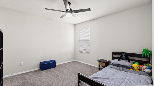 bedroom with ceiling fan, baseboards, and carpet floors