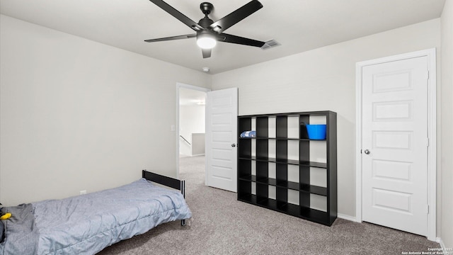 bedroom featuring visible vents, ceiling fan, and carpet