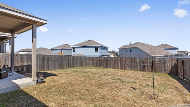 view of yard with a fenced backyard