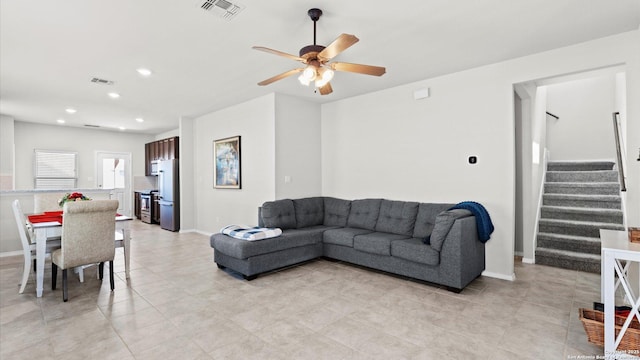 living room featuring visible vents, recessed lighting, stairs, and a ceiling fan