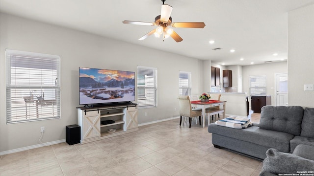 living area with visible vents, baseboards, recessed lighting, light tile patterned flooring, and a ceiling fan