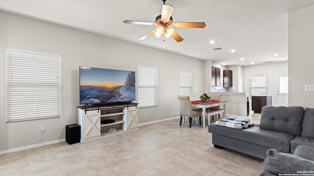 living area with recessed lighting, baseboards, visible vents, and ceiling fan