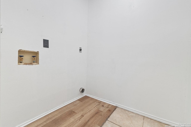 washroom featuring baseboards, light wood finished floors, laundry area, electric dryer hookup, and washer hookup