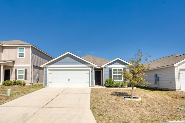 11851 Davalos Ln, San Antonio, TX 78252 - view of front facade featuring a front yard, an attached garage, and driveway