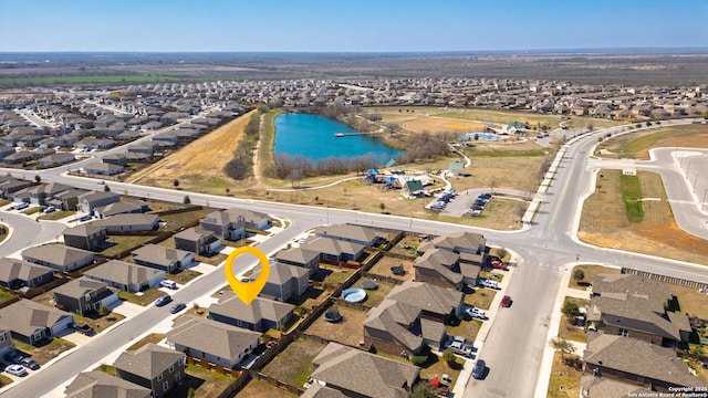 birds eye view of property featuring a residential view and a water view