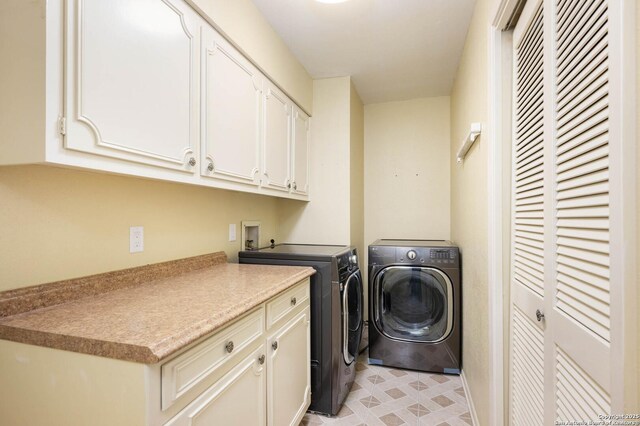 laundry room featuring washer and dryer and cabinet space