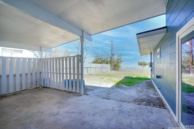 view of patio / terrace featuring fence