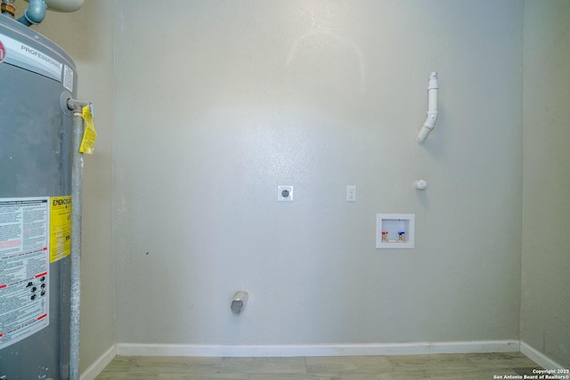 laundry area with electric dryer hookup, water heater, baseboards, hookup for a washing machine, and laundry area