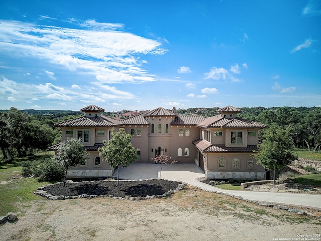 view of front of property with stucco siding and a tiled roof