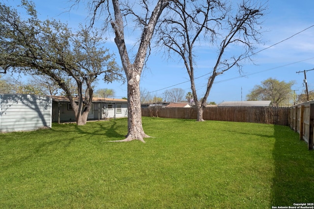 view of yard with a fenced backyard