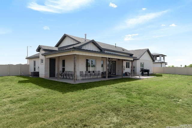 rear view of property with a patio area, cooling unit, a fenced backyard, and board and batten siding