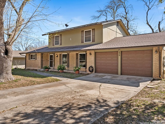 traditional-style home with brick siding, an attached garage, and concrete driveway