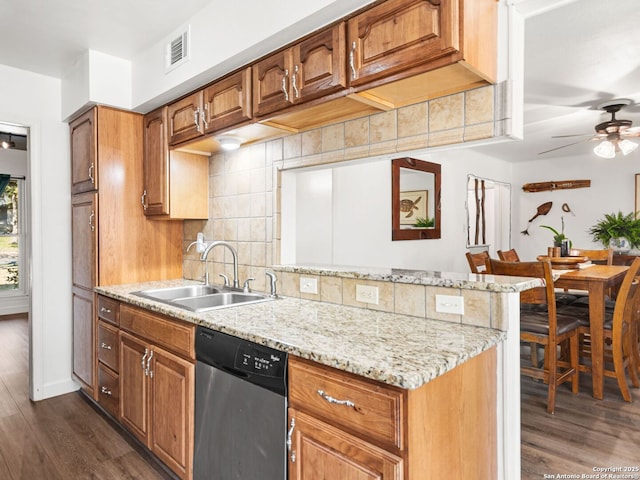 kitchen with visible vents, a ceiling fan, a sink, stainless steel dishwasher, and decorative backsplash