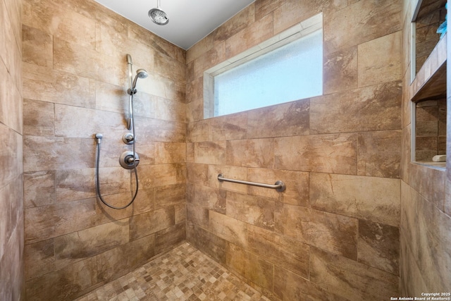 full bathroom with a tile shower